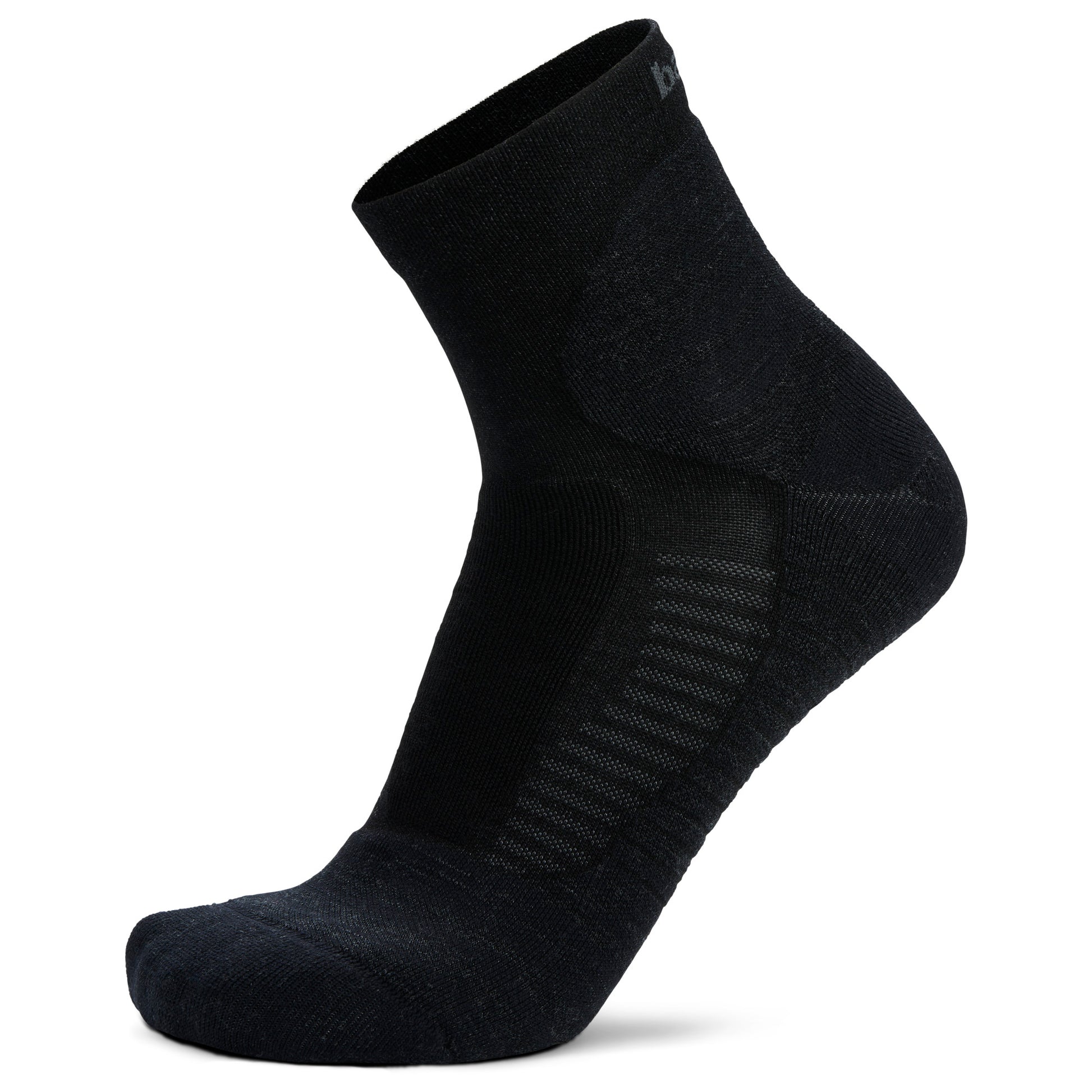 Black sock stands upright on white backdrop, showing fabric texture and ankle height.
