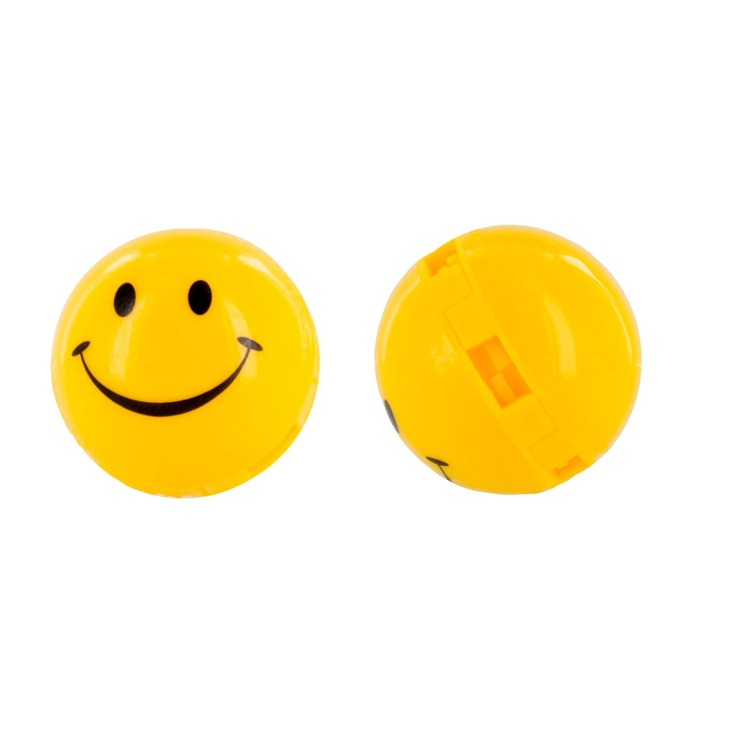 Smiley face ball rolls on a white surface.