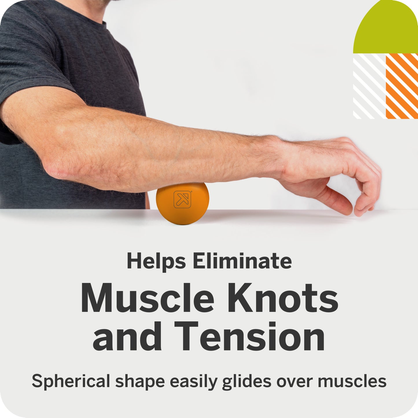 A person uses a spherical massage ball to relieve muscle knots in a bright room.