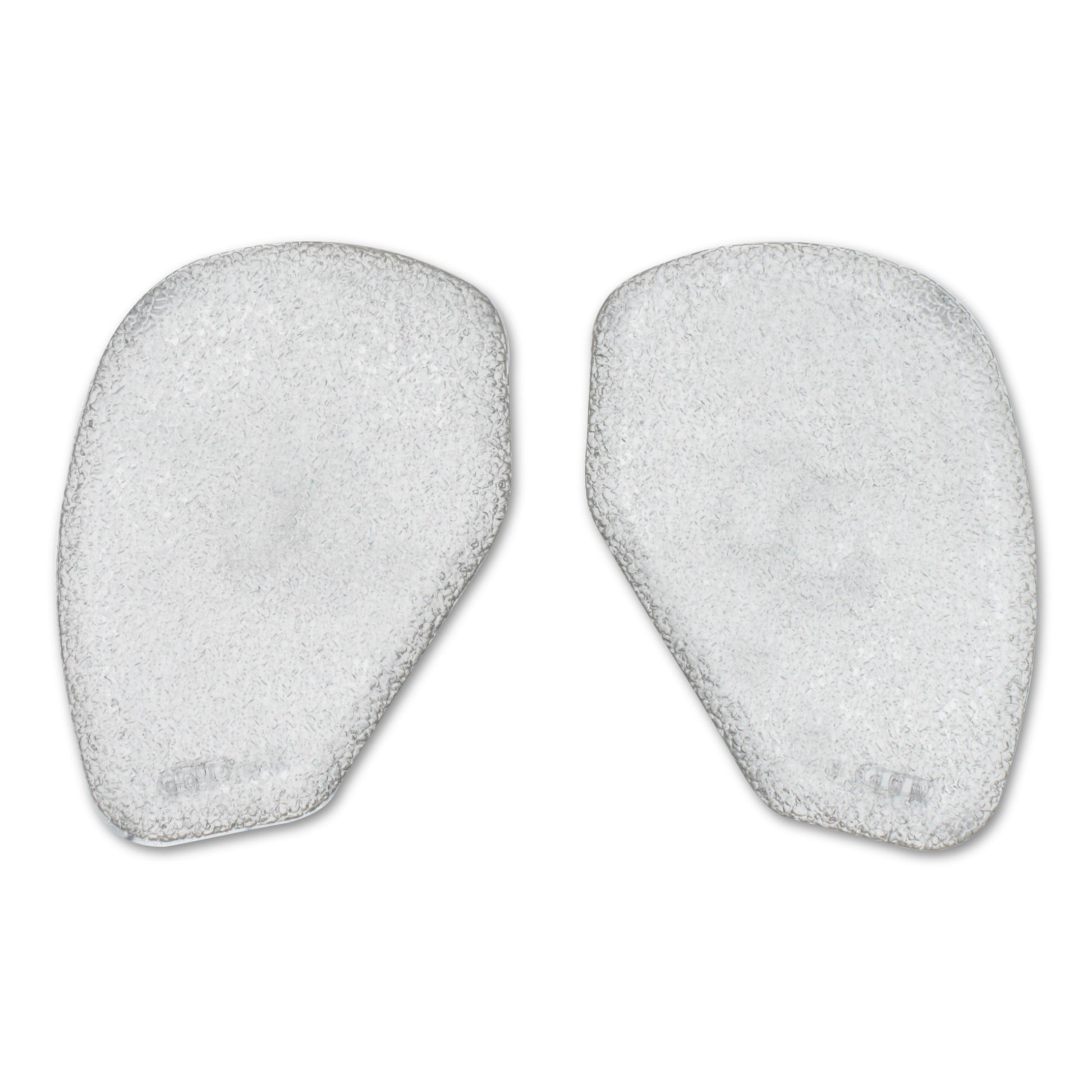 Two white foam pads used for skincare or facial cleansing in a white environment.