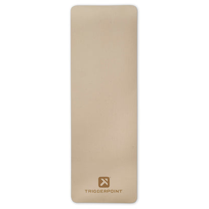 Triggerpoint foam roller rolls on a plain surface for muscle massage and relaxation.