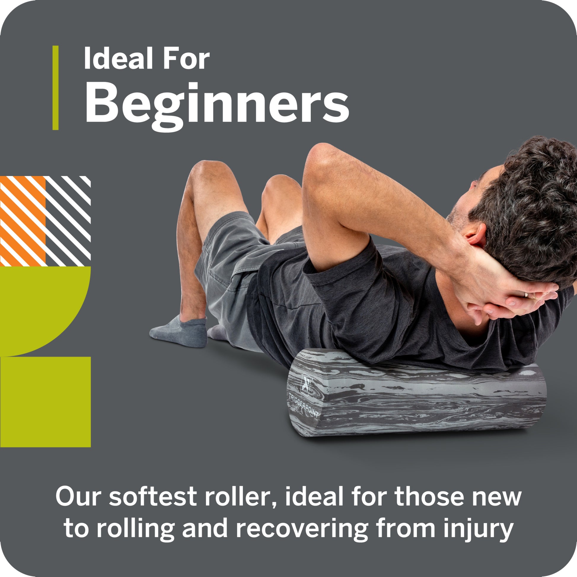 A person uses a foam roller on their back in a gym environment for muscle recovery.