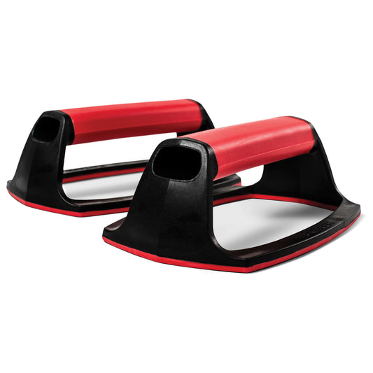 Two pushup bars are used for exercise in a gym environment.