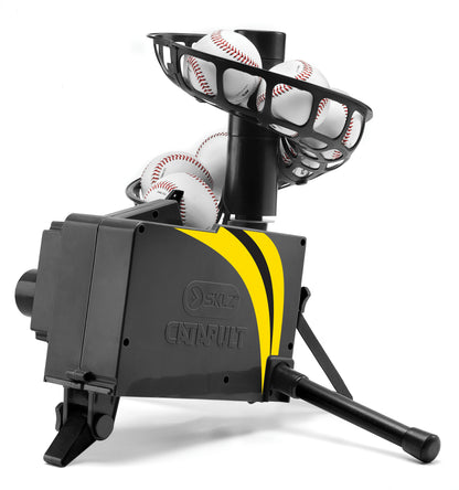 A baseball pitching machine throws balls into the air in a studio setting