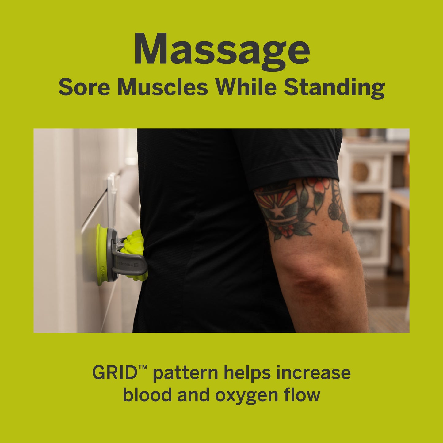 Sore arm touches wall while holding massage device with pattern increases blood flow.