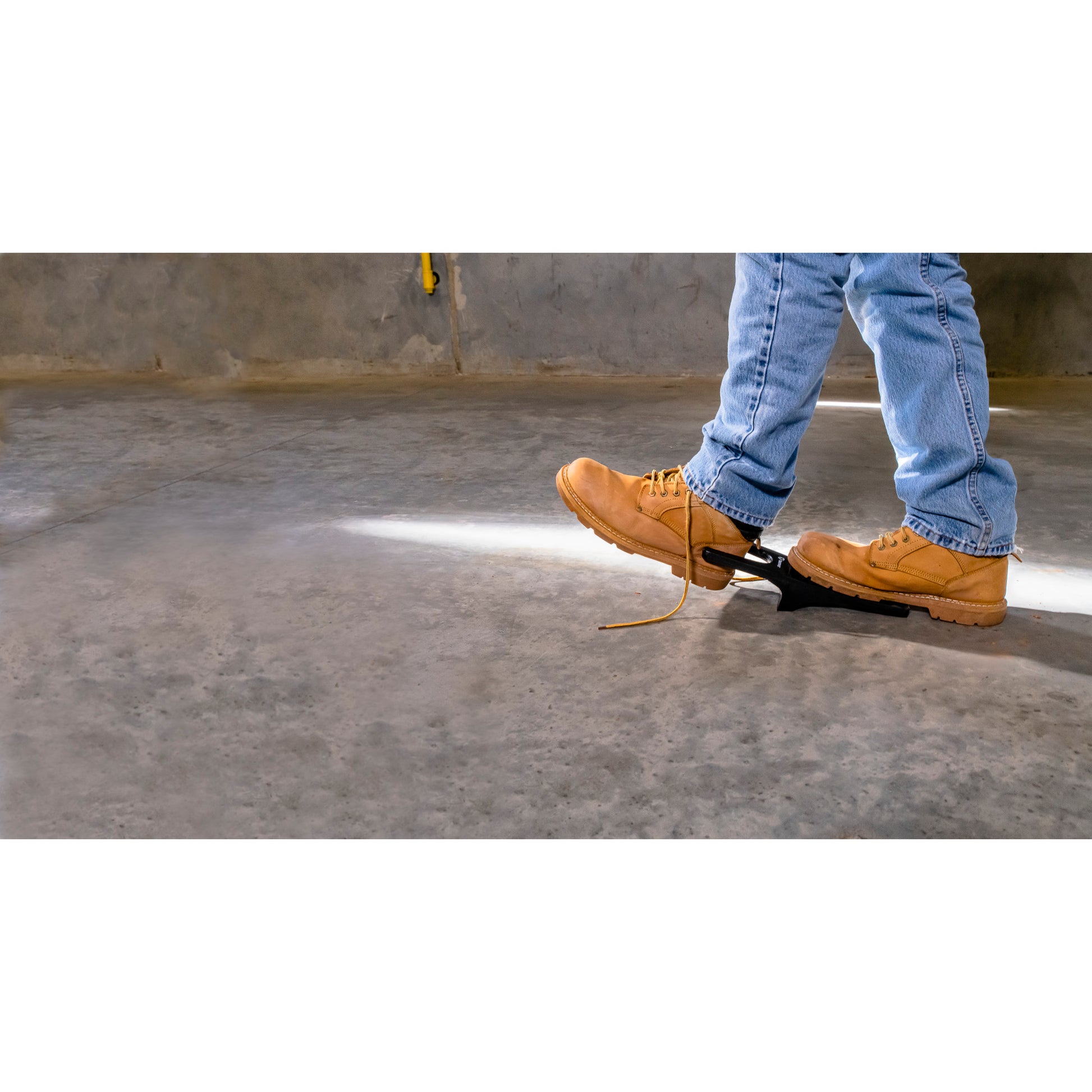 Feet trip over hazard in construction site.