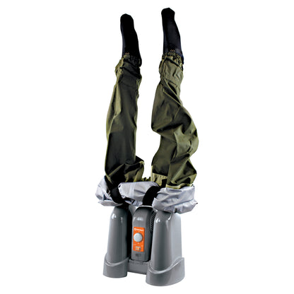 A person is upside down wearing waterproof pants in a footbath or washing station.