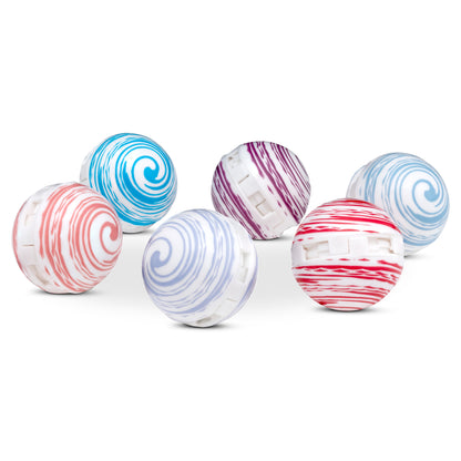 Colorful yo-yos with swirl patterns roll on a white surface in this image.