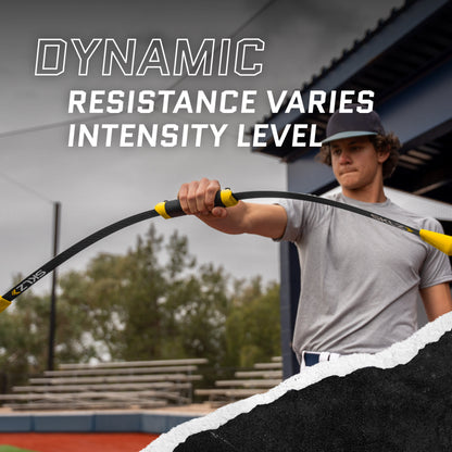 Boy holds resistance band during workout outdoors with stadium seats in background