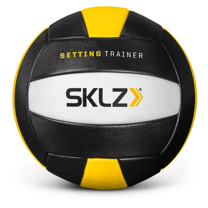 A black yellow and white medicine ball with the words Sklz setting trainer on it
