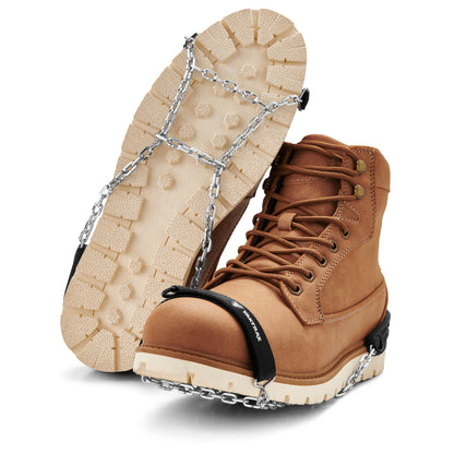 Boots are equipped with ice grips for traction on icy surfaces in winter outdoor environment.