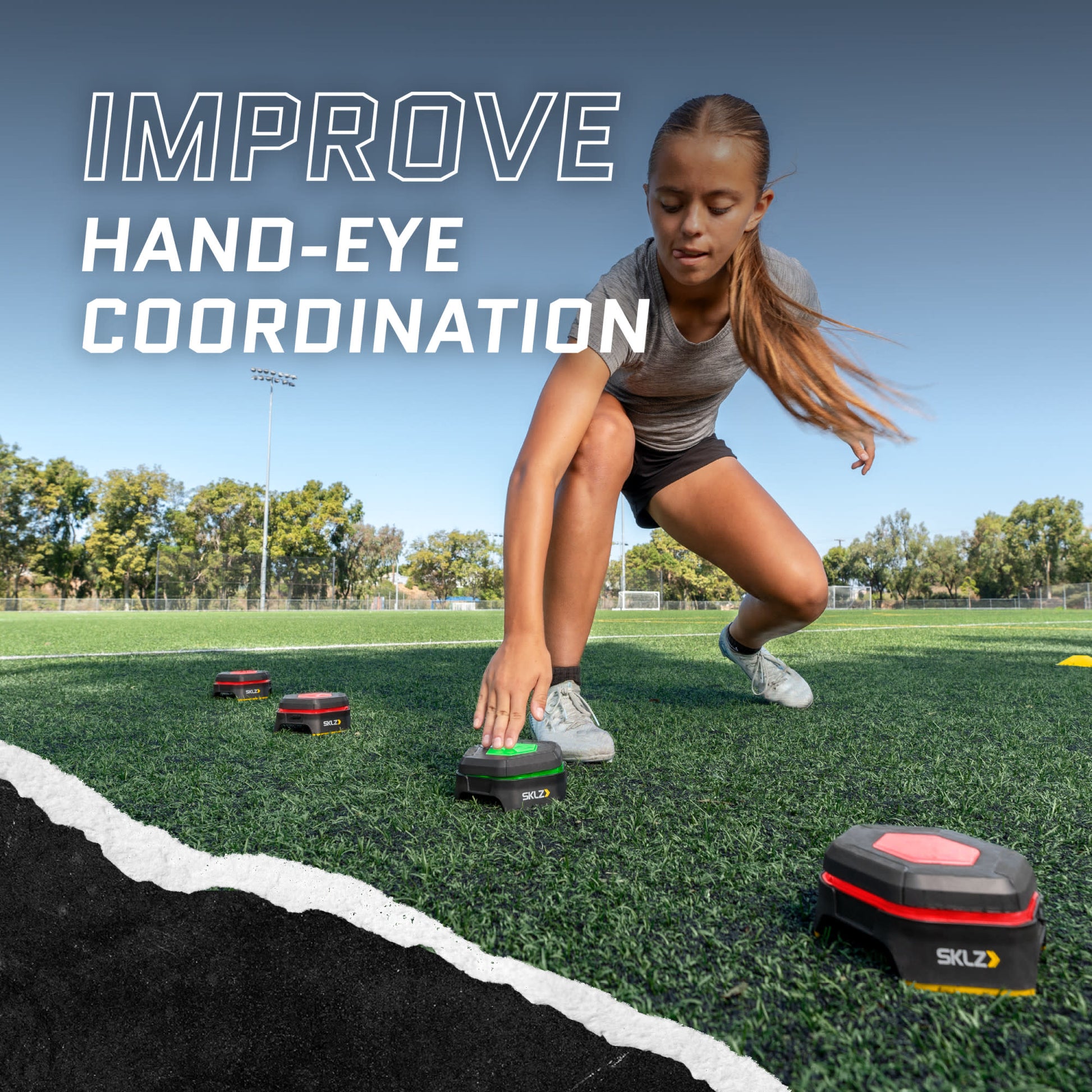 Girl practices footwork with speed training gadgets on a sports field to improve coordination