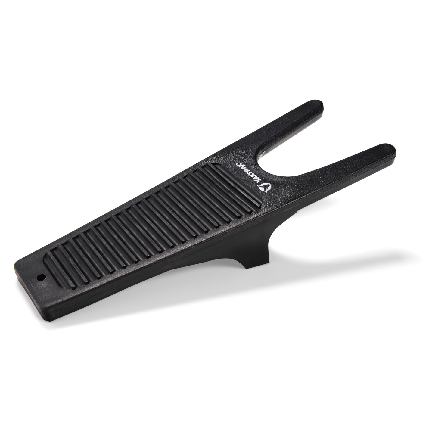 Boot jack resting on a white surface, featuring ribbed grip and U-shaped opening.