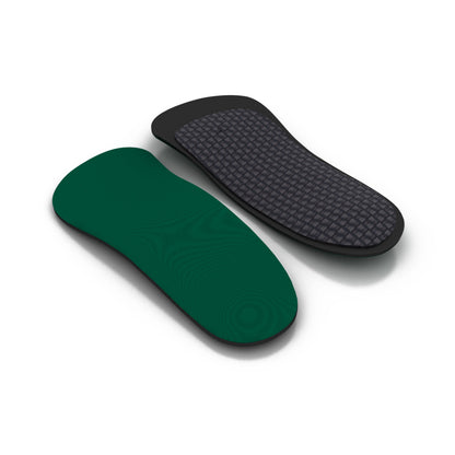 Shoe insoles rest on a white surface in a neutral setting