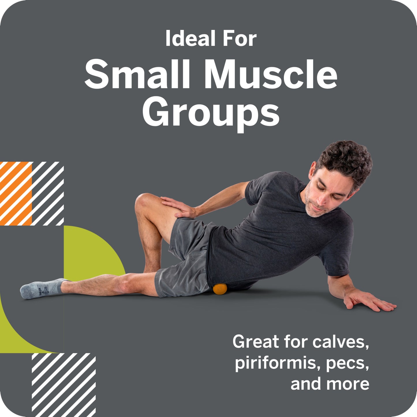 Man uses small ball for muscle relief on side, against a gray background.