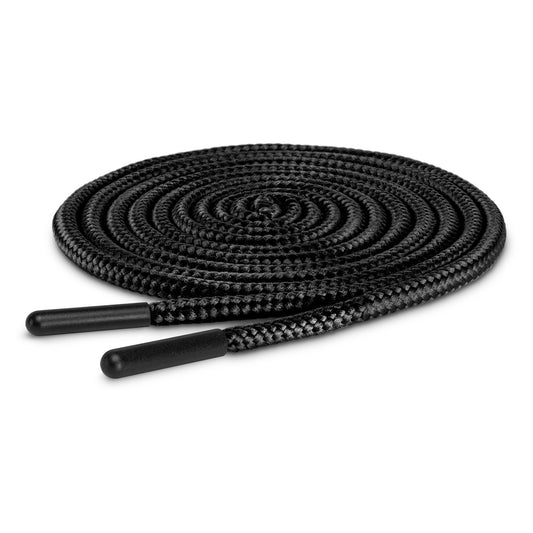 A black shoelace is coiled on a white background.